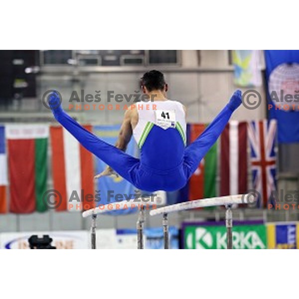 Alen Dimic of Slovenia competing at Parallel Bars during Artistic Gymnastics World Challenge Cup in Hala Tivoli, Ljubljana, Slovenia on April 20, 2014