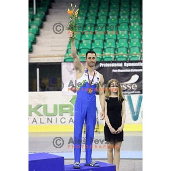 Alen Dimic of Slovenia competing at Parallel Bars during Artistic Gymnastics World Challenge Cup in Hala Tivoli, Ljubljana, Slovenia on April 20, 2014