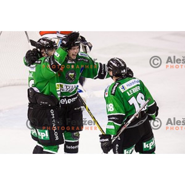 Ales Music, Hunter Bishop, Rok Leber in action during ice hockey match Olimpija - Znojmo, EBEL League, Tivoli , Ljubljana, 19.09.2014