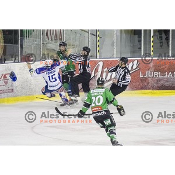 Kyle Medvec and Gregor Koblar in action during ice hockey match of 5th round of EBEL League in Season 2014/15 between HDD Telemach Olimpija and EC VSV, played in Tivoli Hall, Ljubljana, Slovenia, on September 26, 2014