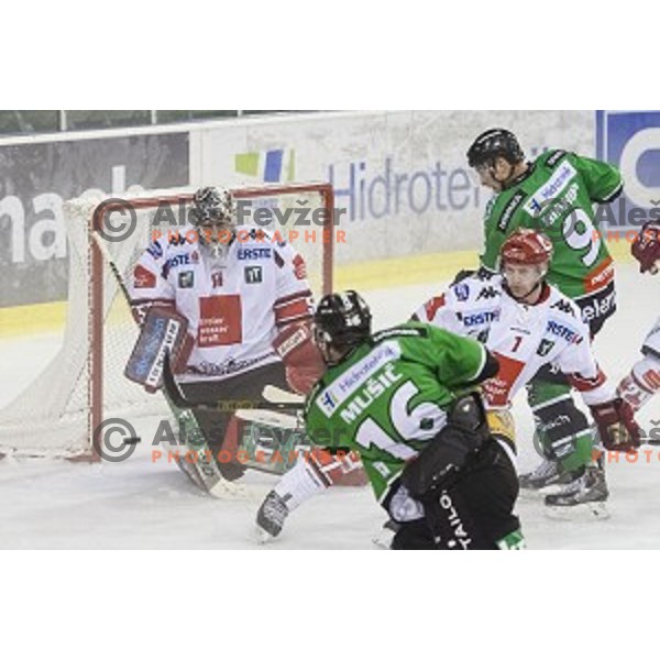 Ales Music and Hunter Bishop in action during ice hockey match of 6th round of EBEL League in Season 2014/15 between HDD Telemach Olimpija and HC TWK Innsbruck, played in Tivoli Hall, Ljubljana, Slovenia, on September 28, 2014