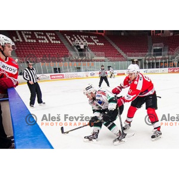 Nejc Berlisk of olimpija and Saso Rajsar of Jesenice in action during ice hockey match of Slovenian National League in Season 2014/15 between HDD SIJ Acroni Jesenice and HDD Telemach Olimpija, played in Podmezakla hall, Jesenice, Slovenia, on October 28th, 2014