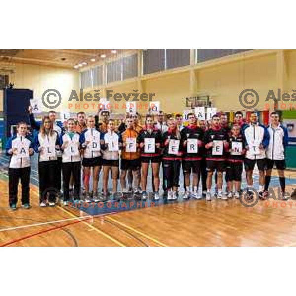 Slovenia and Forea Island team group photo with holding a sign \'All equal, all different\', during badminton match between Slovenia and Forea Island on European Mixed Team Championship 2015, 7.11.2014, Lendava