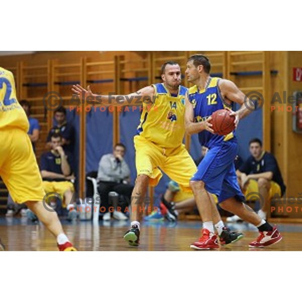 JUre Erzen of Sencur and Goran Jagodnik of Hopsi Polzela in action during Telemach league basketball match Sencur Gorenjska gradbena druzba-Hopsi Polzela, played in Sencur, Slovenia on November 8, 2014