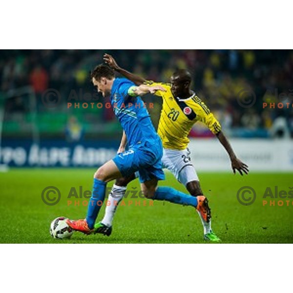 Nejc Pecnik, Adrian Ramos in action during football match Slovenia - Colombia, Src Stozice, Ljubljana, Slovenia, 18.11.2014