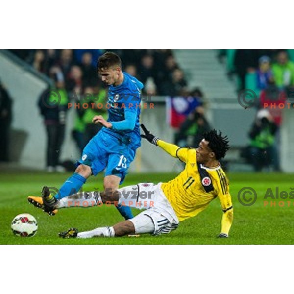 Peter Stojanovic, Juan Cuardado in action during football match Slovenia - Colombia, Src Stozice, Ljubljana, Slovenia, 18.11.2014