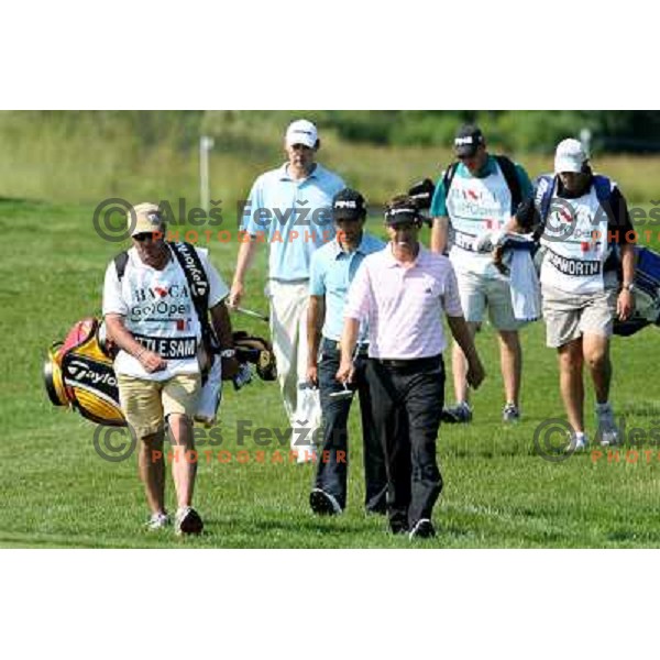 Sam Little, Steven Jeppesen, James Hepworth and their caddies walking to the green in Fontana, Austria 