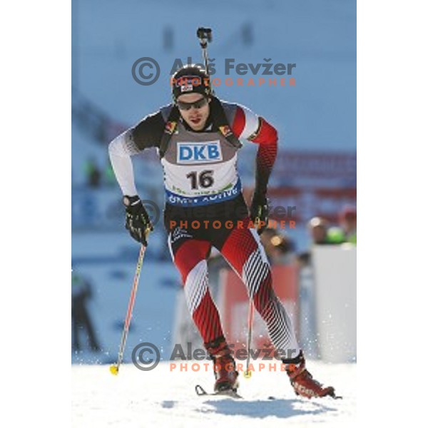 Dominik Landertinger of Austria during BMW IBU World Cup Biathlon Men 10 km sprint at Pokljuka, Slovenia on December 19, 2014