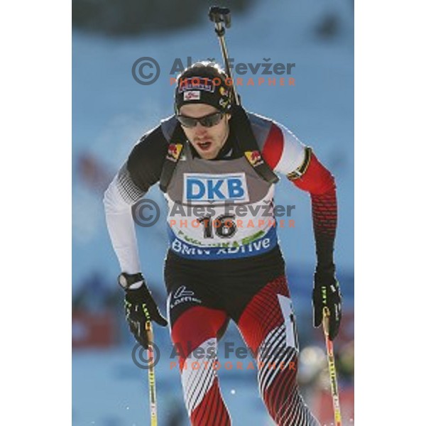 Dominik Landertinger of Austria during BMW IBU World Cup Biathlon Men 10 km sprint at Pokljuka, Slovenia on December 19, 2014