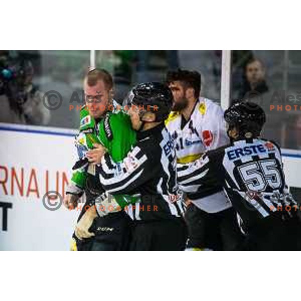 Bostjan Groznik of olimpija and Guillaume Desbiens of Dornbirn in action during ice hockey match of Ice Fest-30th round of EBEL League in Season 2014/15 between HDD Telemach Olimpija and EC Dornbirn, played in Trg republike, Ljubljana, Slovenia, on December 23, 2014