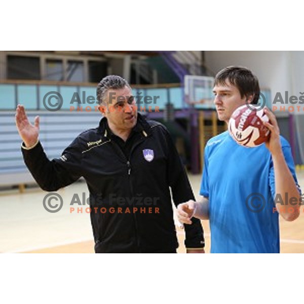 Boris Denic, head coach of Slovenia and Sebastjan Skube in action during practice session in Zrece Sports Hall on January 2, 2015