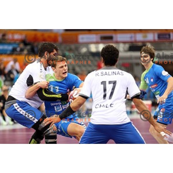 Jure Dolenec in action at Preliminary Group A match Slovenia-Chile at Qatar 2015 World Handball championships in Al Saad Sport Arena, Doha on January 16, 2015