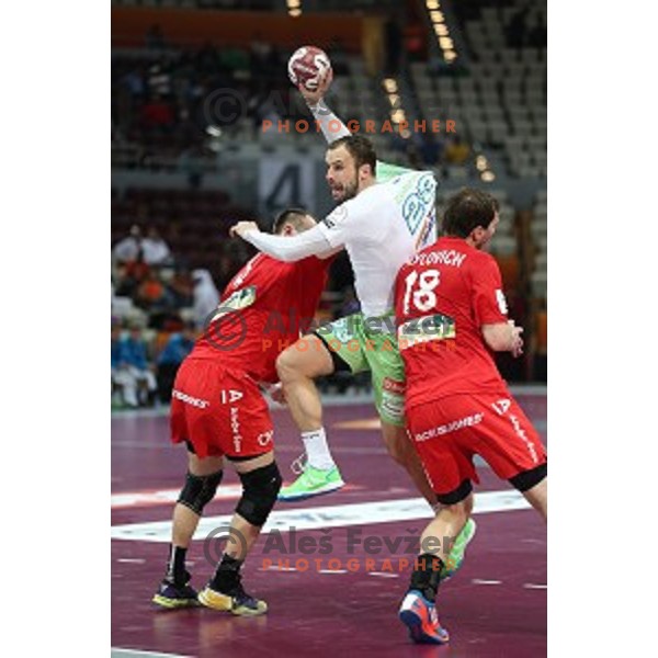 Uros Zorman of Slovenia in action at Preliminary Group A match Slovenia-Belarus at Qatar 2015 World Handball championships in Lusail Sport Arena, Doha on January 17, 2015