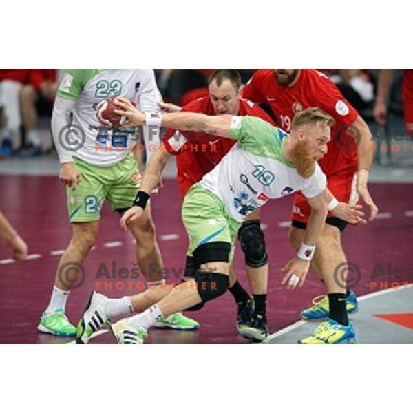 Miha Zvizej of Slovenia in action at Preliminary Group A match Slovenia-Belarus at Qatar 2015 World Handball championships in Lusail Sport Arena, Doha on January 17, 2015