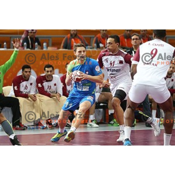 Jure Dolenec of Slovenia in action at Preliminary Group A match Slovenia-Qatar at Qatar 2015 World Handball championships in Lusail Sport Arena, Doha on January 19, 2015