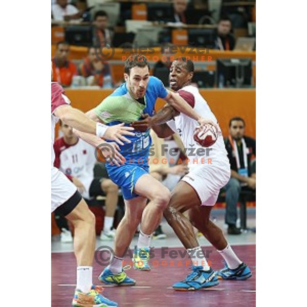 action at Preliminary Group A match Slovenia-Qatar at Qatar 2015 World Handball championships in Lusail Sport Arena, Doha on January 19, 2015