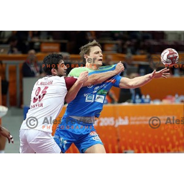 Jure Dolenec of Slovenia in action at Preliminary Group A match Slovenia-Qatar at Qatar 2015 World Handball championships in Lusail Sport Arena, Doha on January 19, 2015