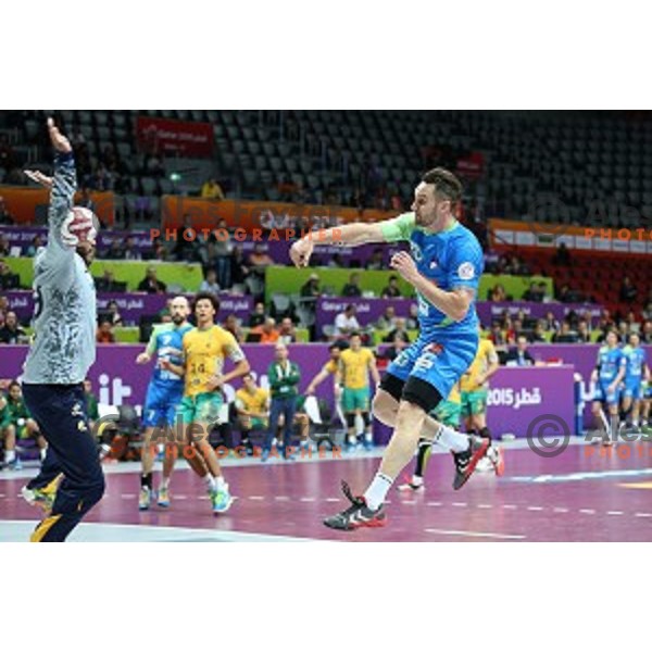 Luka Zvizej of Slovenia in action at Preliminary Group A match Slovenia-Brazil at Qatar 2015 World Handball championships in Duhail Sport Arena, Doha on January 21, 2015