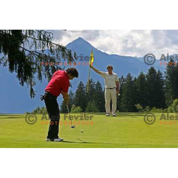 Putting at green of hole Nr.2 at Millstatter See golf club in Austria. Photo by Ales Fevzer 