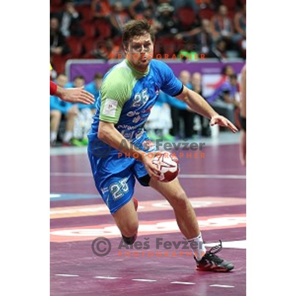 Marko Bezjak of Slovenia in action at Preliminary Group A match Slovenia-Spain at Qatar 2015 World Handball championships in Duhail Sport Arena, Doha on January 23, 2015