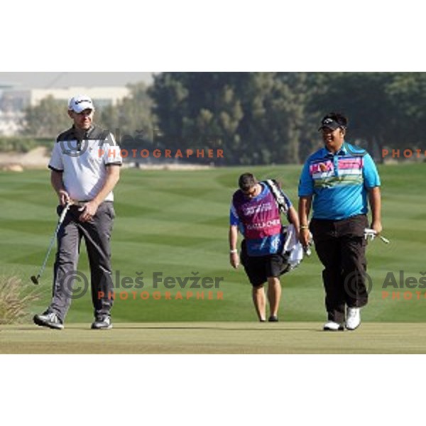 Stephen Gallacher (SCO) and Kiradech Aphibarnrat (THA) in action in final round of Commercial Bank Qatar Masters, European Tour tournament, Doha Golf Club, Qatar on January 24, 2015