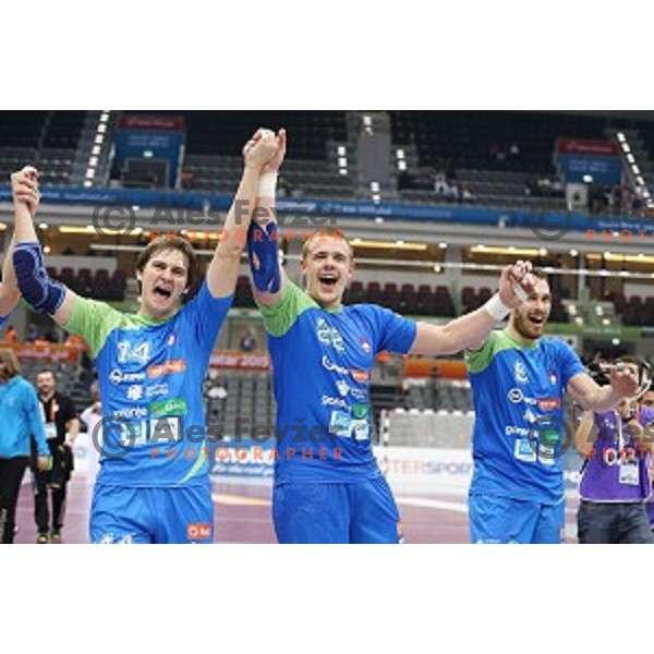 Players of Slovenia celebrate victory in eight-final match Slovenia-Macedonia at Qatar 2015 World Handball championships in Al Saad Sport Arena, Doha on January 25, 2015