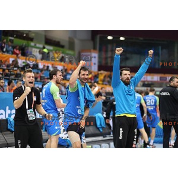 Players of Slovenia celebrate victory in eight-final match Slovenia-Macedonia at Qatar 2015 World Handball championships in Al Saad Sport Arena, Doha on January 25, 2015