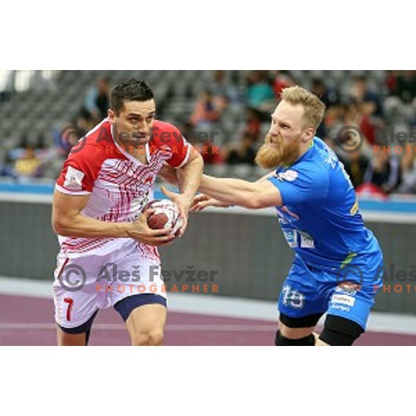 Kiril Lazarev of Macedonia and Miha Zvizej of Slovenia in action during eight-final match Slovenia-Macedonia at Qatar 2015 World Handball championships in Al Saad Sport Arena, Doha on January 25, 2015