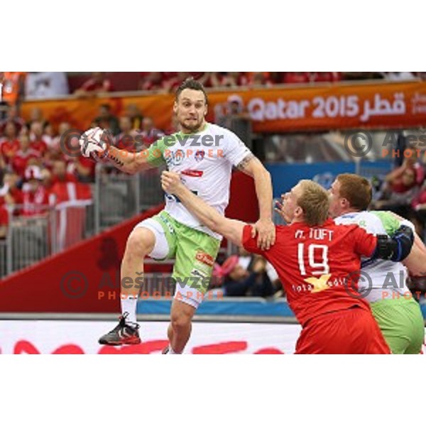 Luka Zvizej of Slovenia in action during placement match 5-8 between Slovenia and Denmark at Qatar 2015 World Handball championships in Al Sadd Sport Arena, Doha on January 30, 2015