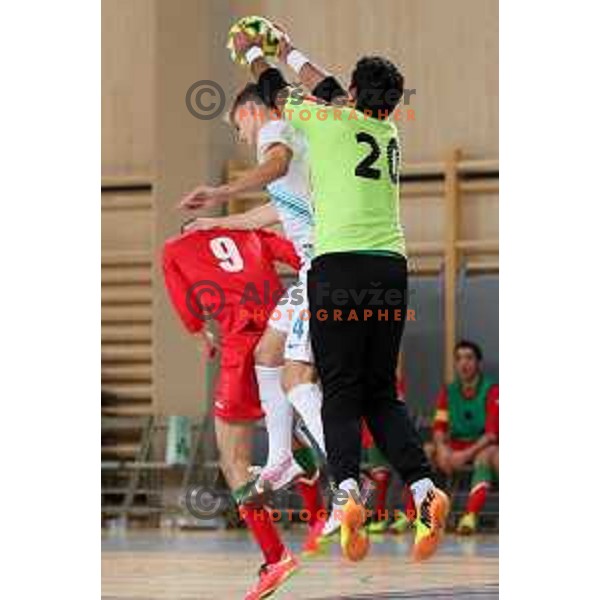 Sefidi Sang Mohammadreza and Samimi Alireza of Iran vs Matej Fidersek of Slovenia during friendly Futsal match between Slovenia and Iran, played in Kidricevo, Slovenia on February 10, 2015