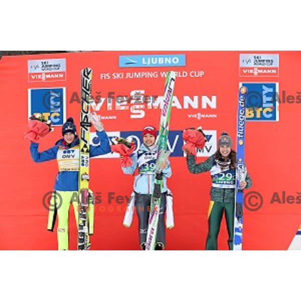 Daniela Iraschko-Stolz (AUT), Sara Takanashi (JPN) and Sarah Hendrickson (USA) at podium of FIS Ski jumping World Cup in Ljubno, Slovenia on February 14, 2015