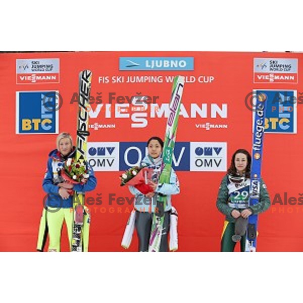 Daniela Iraschko-Stolz (AUT), Sara Takanashi (JPN) and Sarah Hendrickson (USA) at podium of FIS Ski jumping World Cup in Ljubno, Slovenia on February 14, 2015
