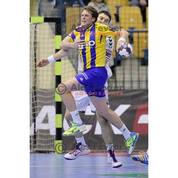 David Miklavcic of Celje Pivovarna Lasko in action during EHF Champions league handball match Celje PL- Chekovski in Zlatorog Hall, Celje, Slovenia on February 21, 2015