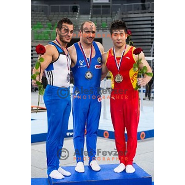 Samir Ait Said of France, Matteo Morandi of Italy and Guanhua Wu of China during Arstistic Gymnastics World Challange Cup Ljubljana 2015, in Stozice Hall, Ljubljana, Slovenia, on April 4th, 2015
