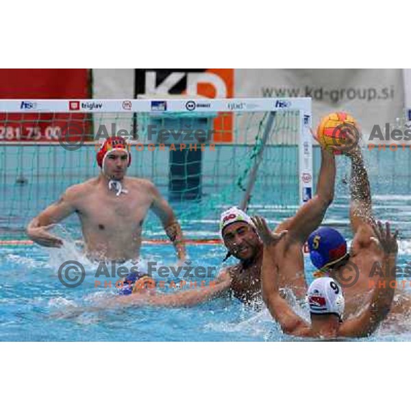 Blaz Verac blocks shot of Nikola Janovic (5) at match Slovenia-Montenegro played at Tristar waterpolo tournament in Kranj, Slovenia 18.8.2007.Photo by Ales Fevzer 