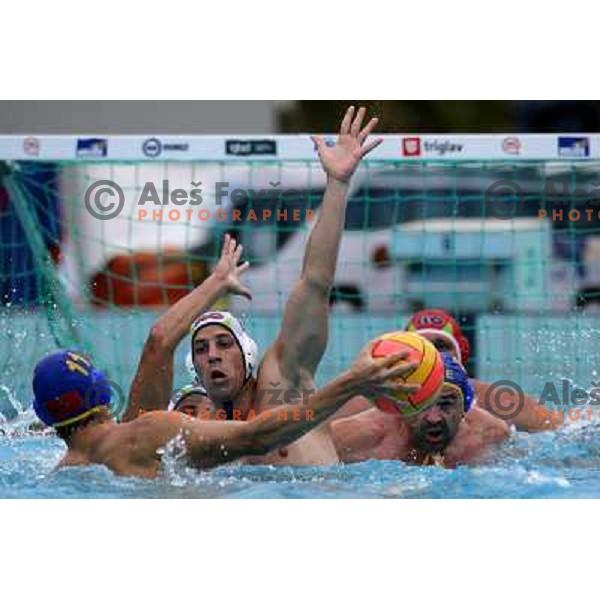 Jure Nastran tries to block shot of Vladimir Gojkovic (11) at match Slovenia-Montenegro played at Tristar waterpolo tournament in Kranj, Slovenia 18.8.2007.Photo by Ales Fevzer 