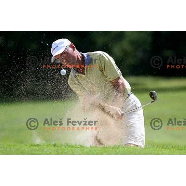 Marjan Urh playing out of a bunker at 11th hole during European Senior Team Championship, played at Kings golf course at Bled, Slovenia 18.8.2007.Photo by Ales Fevzer 