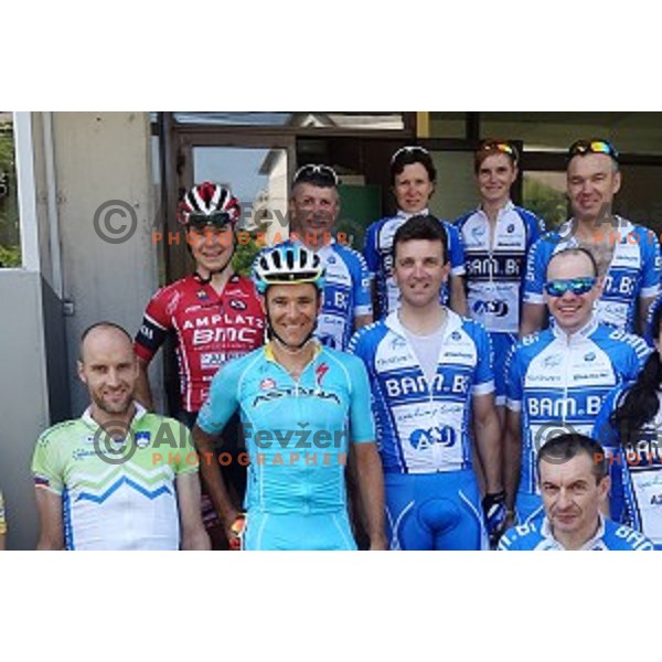 Bambi cycling team members and Jan Tratnik of team Amplatz BMC and Borut Bozic of team Astana in Idrija, Slovenia on June 6, 2015