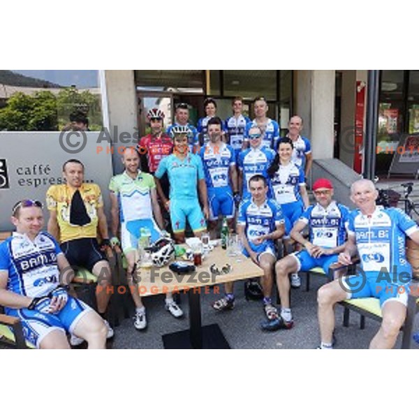 Bambi cycling team members and Jan Tratnik of team Amplatz BMC and Borut Bozic of team Astana in Idrija, Slovenia on June 6, 2015