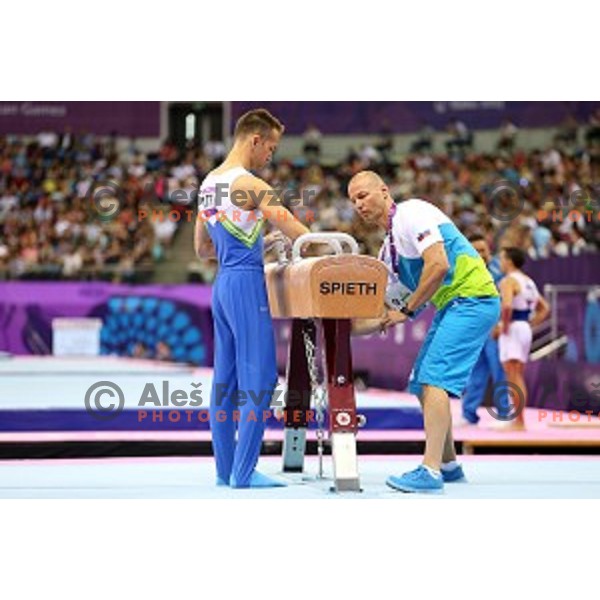 Coach Sebastjan Piletic and Saso Bertoncelj of Slovenia in qualification of pommel horse at First European Games Baku 2015 in National Gymnastics Arena in Baku, Azerbaijan on June 14, 2015