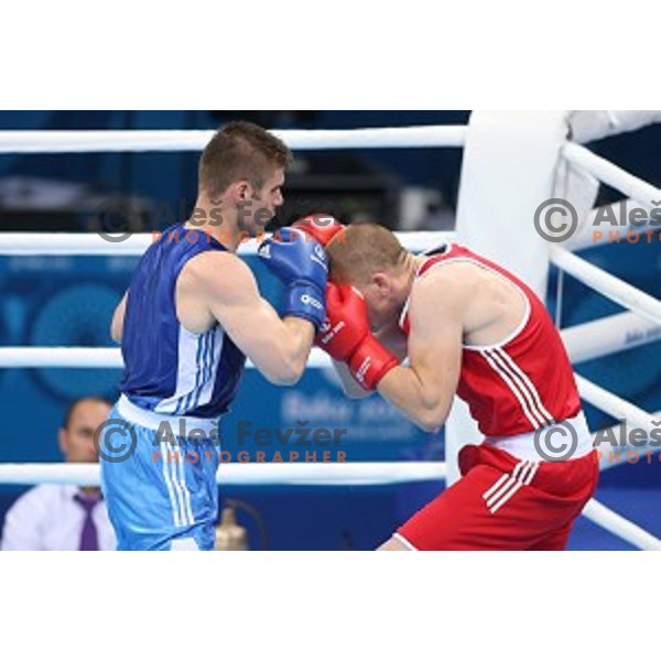 Denis Lazar (red) of Slovenia fights in first round of Box tournament in Crystal Hall during First European Games Baku 2015, Azerbaijan on June 18, 2015