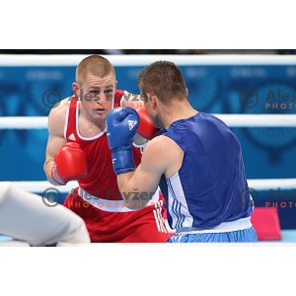 Denis Lazar (red) of Slovenia fights in first round of Box tournament in Crystal Hall during First European Games Baku 2015, Azerbaijan on June 18, 2015