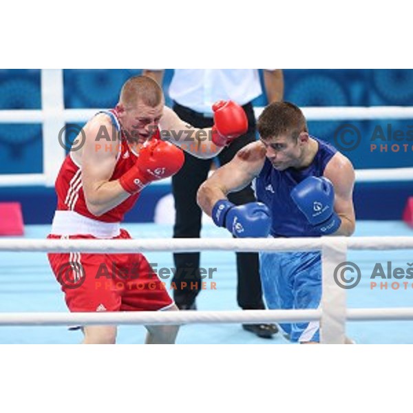 Denis Lazar (red) of Slovenia fights in first round of Box tournament in Crystal Hall during First European Games Baku 2015, Azerbaijan on June 18, 2015