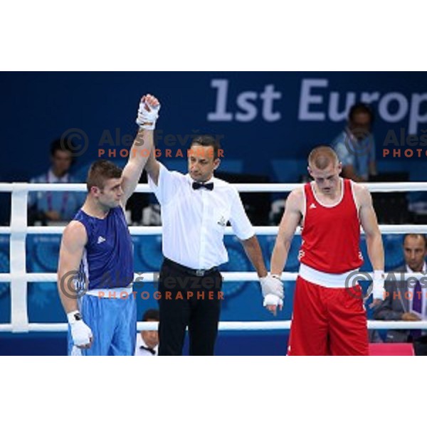 Denis Lazar (red) of Slovenia fights in first round of Box tournament in Crystal Hall during First European Games Baku 2015, Azerbaijan on June 18, 2015
