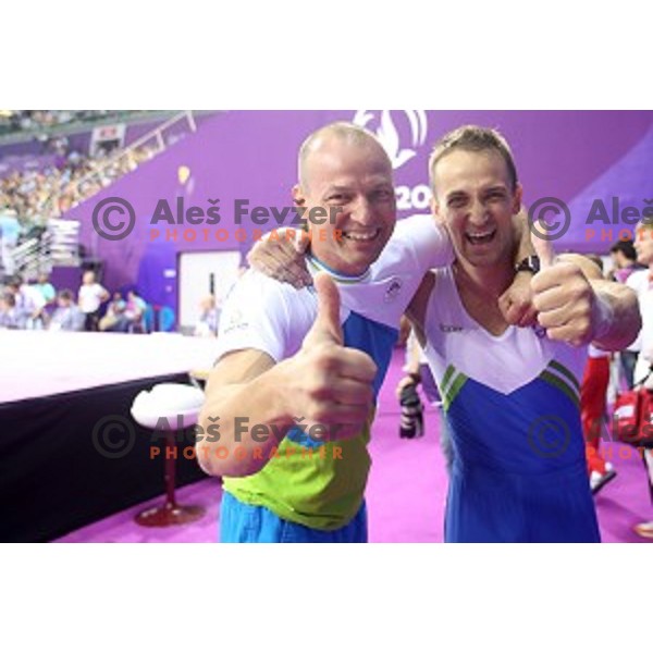 Coach Sebastjan Piletic and Saso Bertoncelj of Slovenia celebrate gold medal in Artistic Gymnastics at pommel horse at First European Games Baku 2015 in National Gymnastics Arena in Baku, Azerbaijan on June 20, 2015