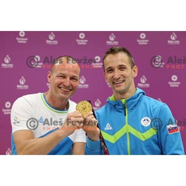 Coach Sebastjan Piletic and Saso Bertoncelj of Slovenia celebrate gold medal in Artistic Gymnastics at pommel horse at First European Games Baku 2015 in National Gymnastics Arena in Baku, Azerbaijan on June 20, 2015