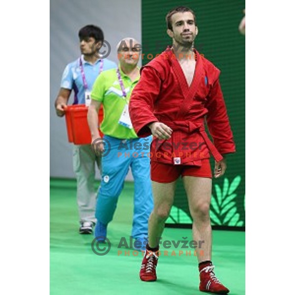 Tadej Cutuk (SLO, red) fights with Kakha Mamulashvili (GEO,blue) in eight-finals of Sambo Men\'s - 74 kg at First European Games Baku 2015 in Heydar Aliyev Arena in Baku, Azerbaijan on June 22, 2015