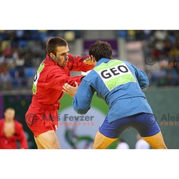 Tadej Cutuk (SLO, red) fights with Kakha Mamulashvili (GEO,blue) in eight-finals of Sambo Men\'s - 74 kg at First European Games Baku 2015 in Heydar Aliyev Arena in Baku, Azerbaijan on June 22, 2015