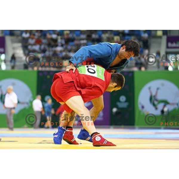 Tadej Cutuk (SLO, red) fights with Kakha Mamulashvili (GEO,blue) in eight-finals of Sambo Men\'s - 74 kg at First European Games Baku 2015 in Heydar Aliyev Arena in Baku, Azerbaijan on June 22, 2015