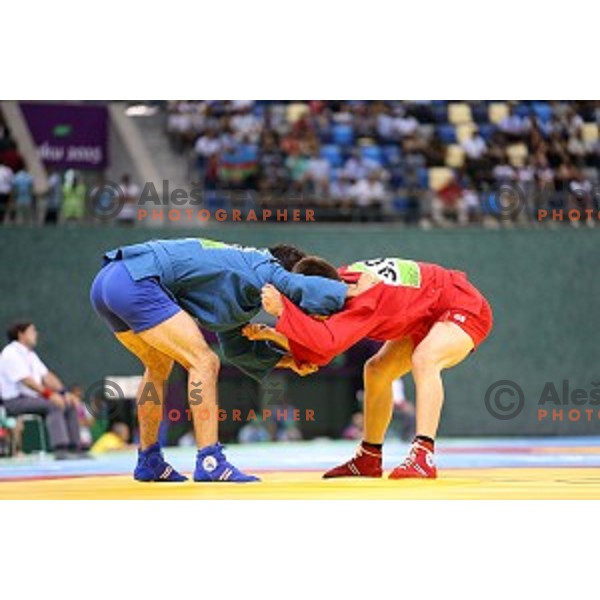 Tadej Cutuk (SLO, red) fights with Kakha Mamulashvili (GEO,blue) in eight-finals of Sambo Men\'s - 74 kg at First European Games Baku 2015 in Heydar Aliyev Arena in Baku, Azerbaijan on June 22, 2015
